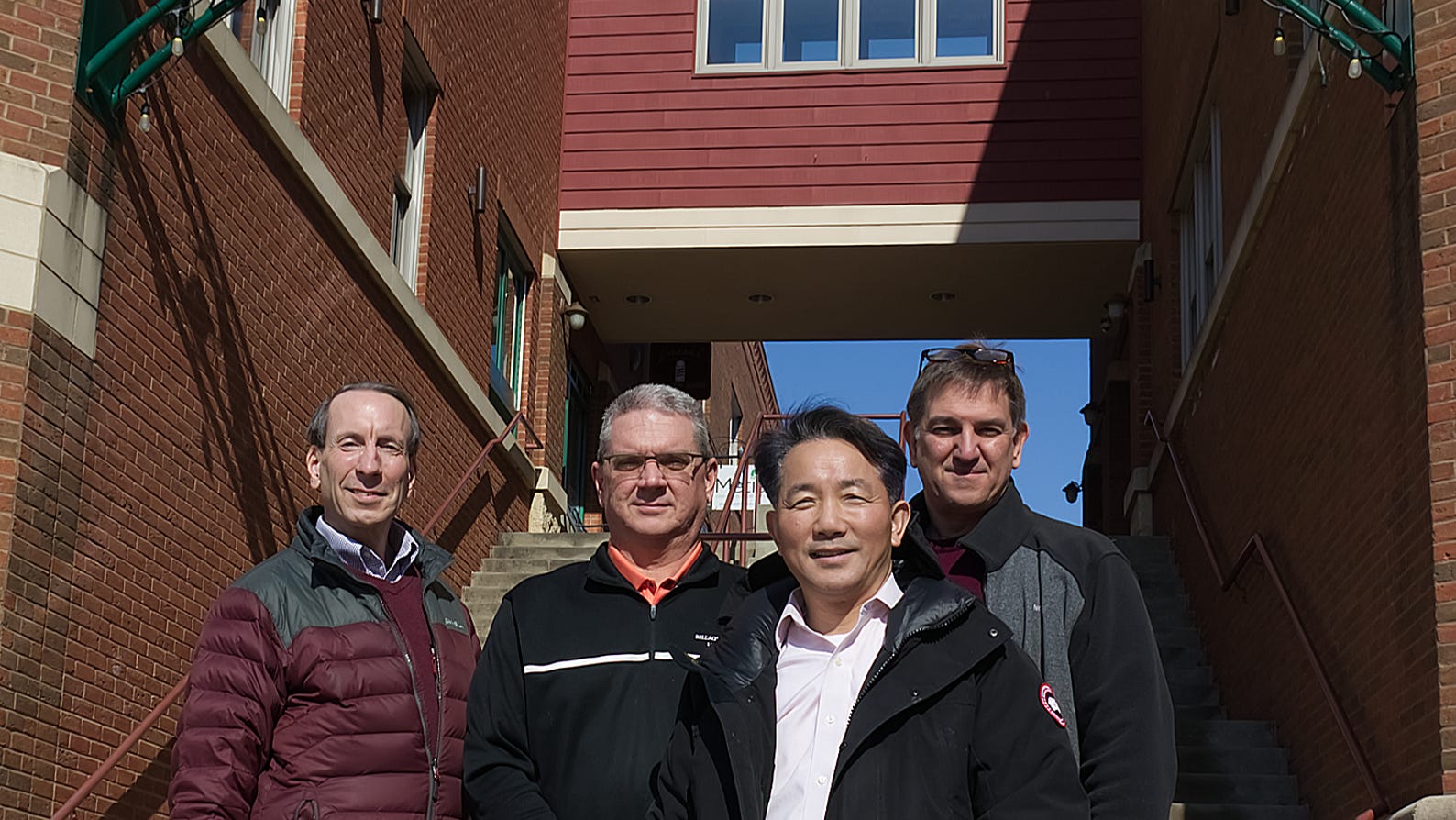 Jason Liu, Owner of Acorn Alley, front along with Kent Economic Director Tom Wilke, Jim Antal, Property Manager & Mike Tarpoff of Muirfield Realty Group